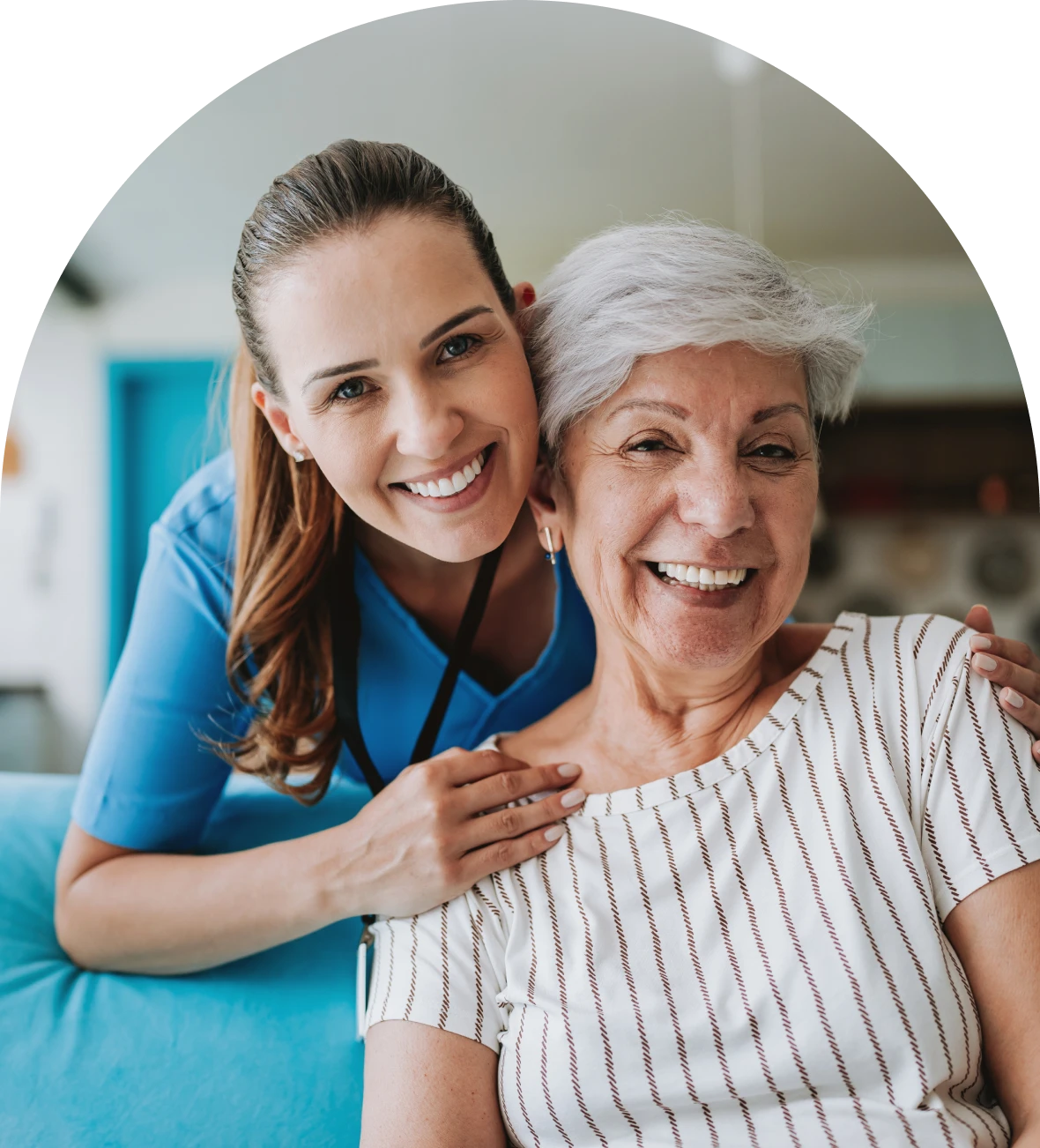 Happy senior and caregiver at home