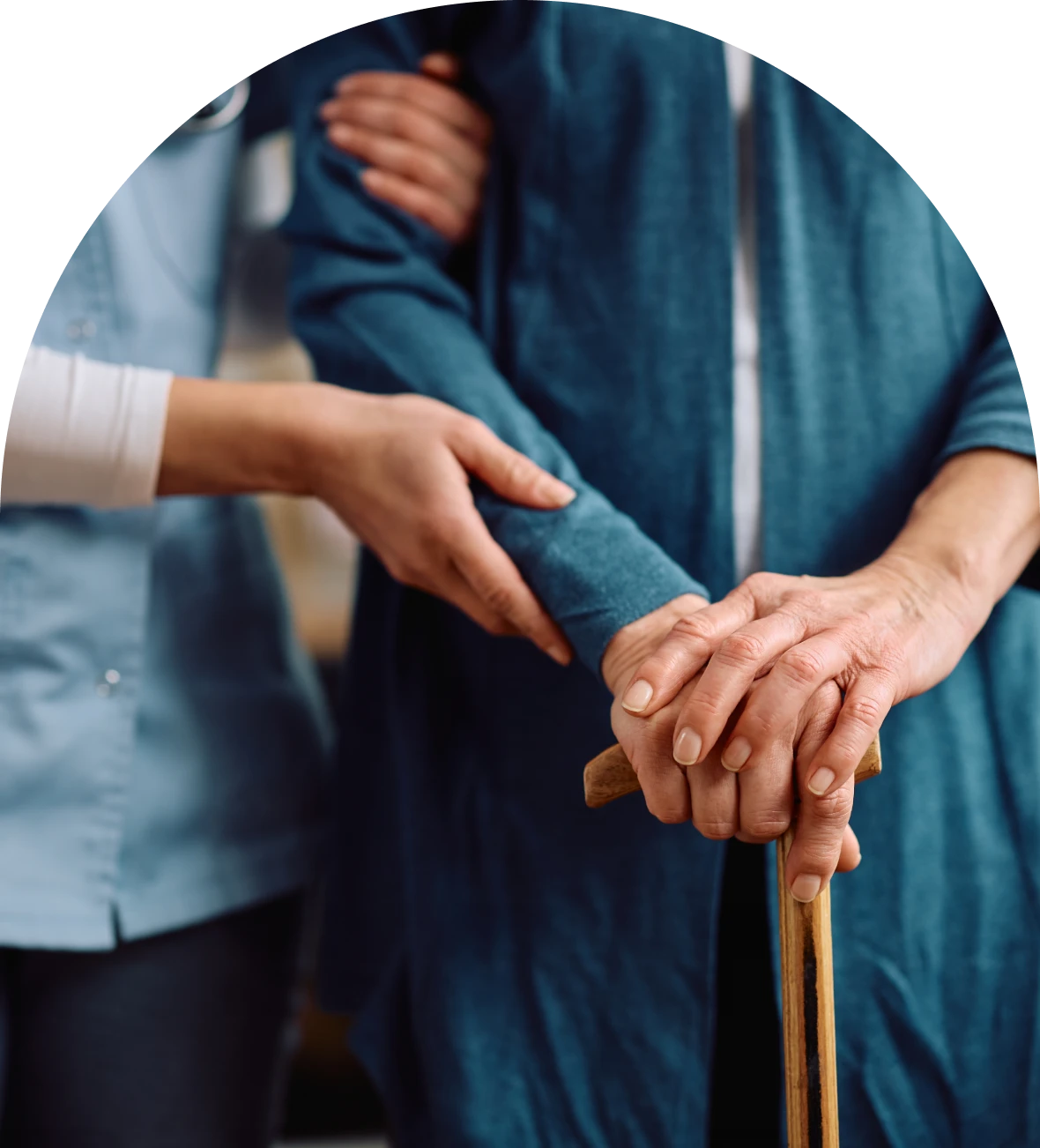 Caregiver assisting elderly individual