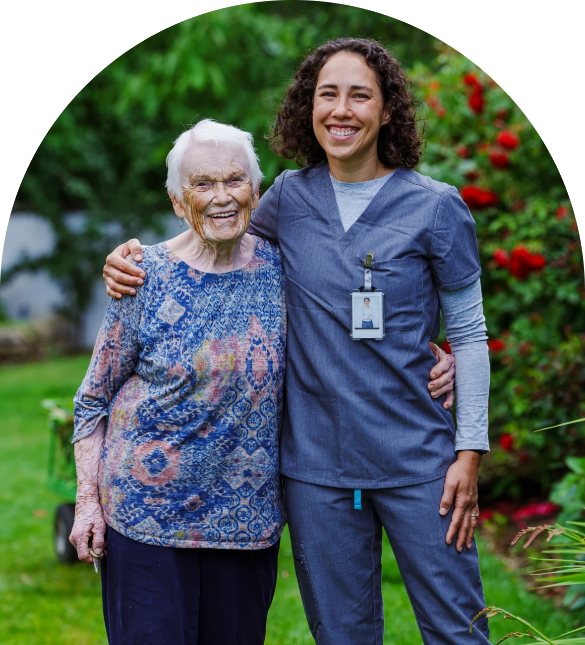Caregiver with senior woman in garden